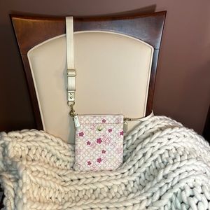 Coach cream sling pack; coated canvas with coach floral pattern with pink & gold